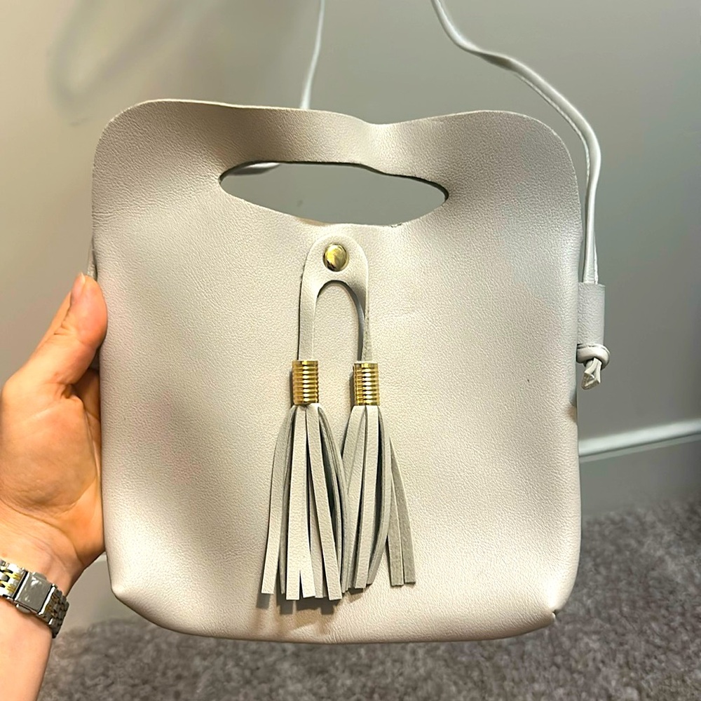 Gray crossbody bag with tassels